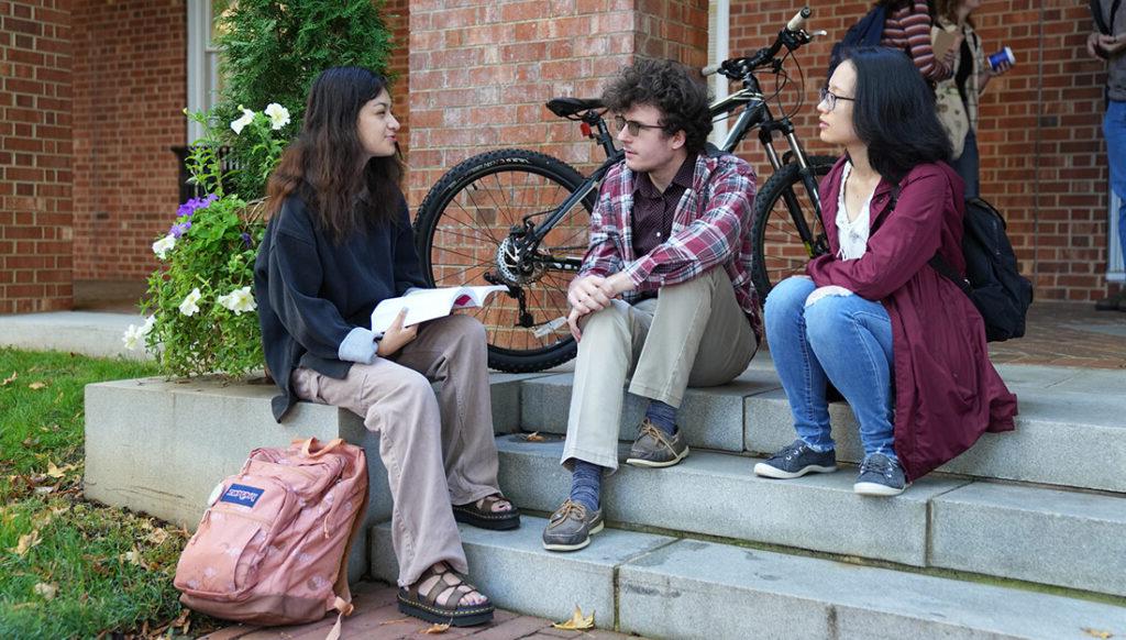 Converse students chat outside